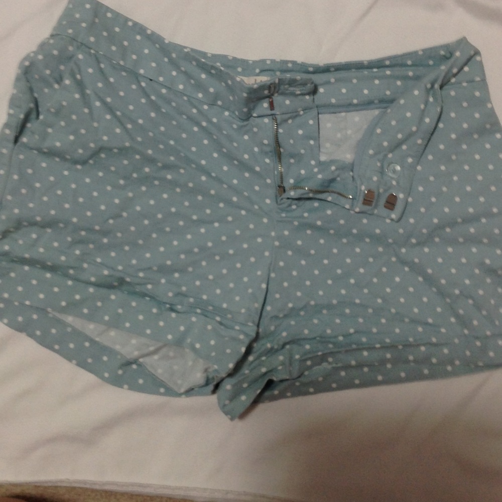 Green and white polka dot shorts